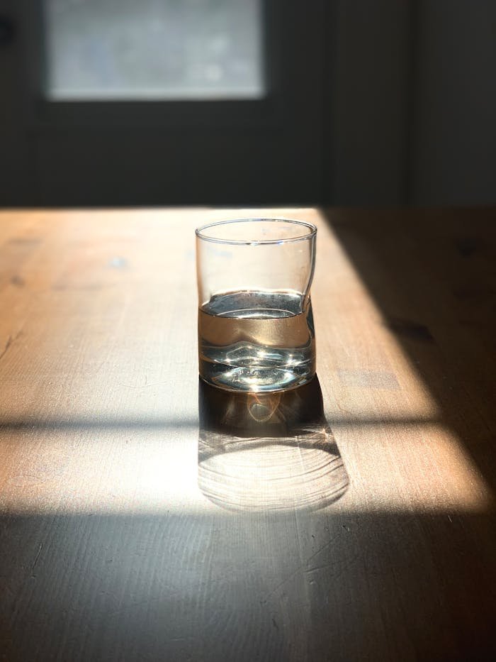 A Glass of Water on a Wooden Surface